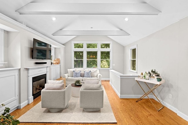 12 Short St, Cohasset, MA 02025 - living area with light wood-style floors and a glass covered fireplace