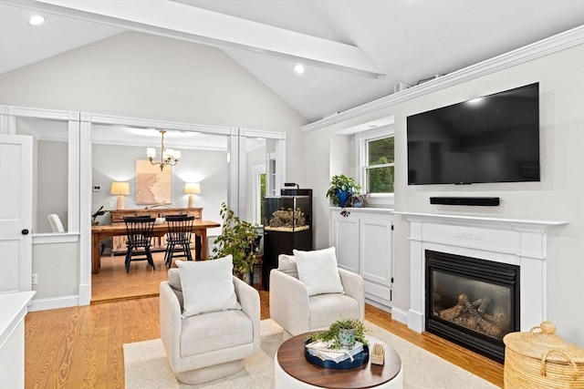 12 Short St, Cohasset, MA 02025 - living room with vaulted ceiling, light wood-style flooring, recessed lighting, a glass covered fireplace, and a chandelier