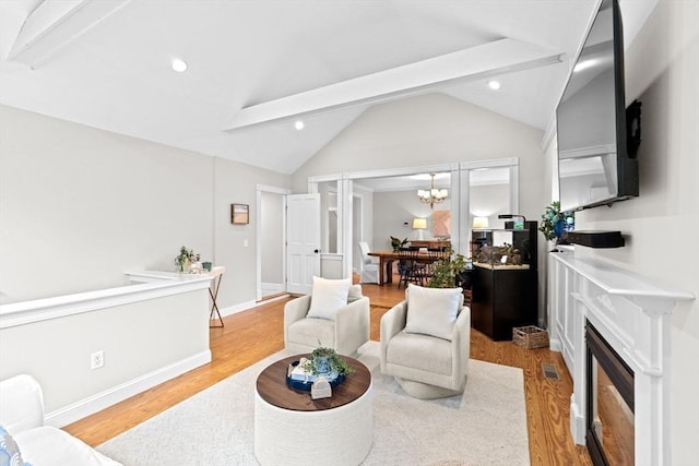 12 Short St, Cohasset, MA 02025 - living room with wood finished floors, beamed ceiling, a chandelier, a fireplace, and recessed lighting