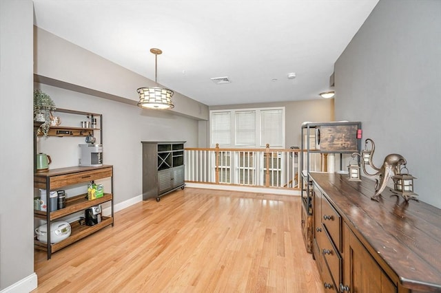 129 Merrimac Unit 19, Newburyport, MA 01950 - living area with light wood-style floors and a fireplace