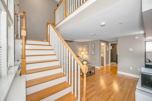 129 Merrimac Unit 19, Newburyport, MA 01950 - stairs featuring wood finished floors and baseboards