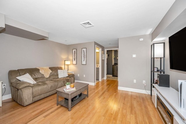129 Merrimac Unit 19, Newburyport, MA 01950 - living room featuring baseboards and light wood finished floors