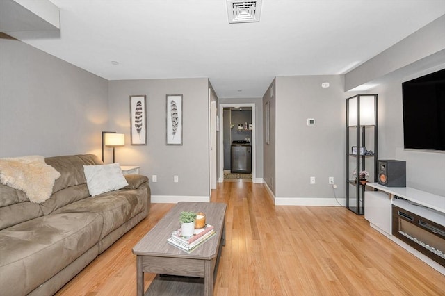129 Merrimac Unit 19, Newburyport, MA 01950 - living room featuring light wood finished floors and baseboards