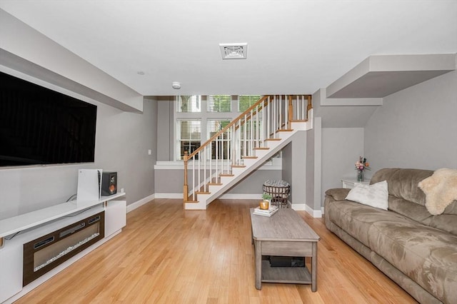 129 Merrimac Unit 19, Newburyport, MA 01950 - living area featuring stairs and wood finished floors