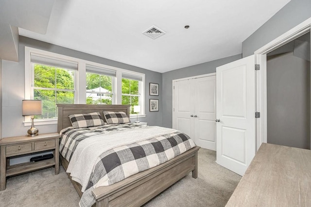 129 Merrimac Unit 19, Newburyport, MA 01950 - bedroom with light carpet and a closet