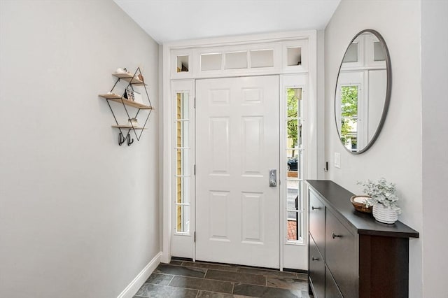 129 Merrimac Unit 19, Newburyport, MA 01950 - foyer featuring stone tile floors and baseboards