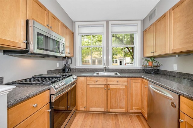 129 Merrimac Unit 19, Newburyport, MA 01950 - kitchen featuring stainless steel appliances and light wood-style flooring