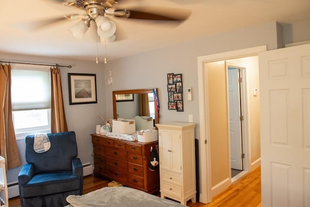 15 Lambert Ave, Stoughton, MA 02072 - bedroom featuring light wood-type flooring, a baseboard heating unit, and a ceiling fan