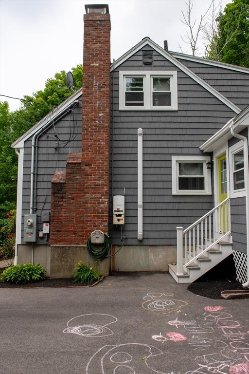 15 Lambert Ave, Stoughton, MA 02072 - view of property exterior featuring a chimney