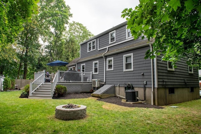15 Lambert Ave, Stoughton, MA 02072 - back of house with a deck and an outdoor fire pit