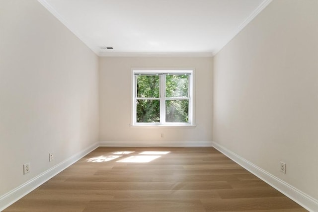 188 Newton Unit 6, Boston, MA 02135 - unfurnished room with crown molding, baseboards, and wood finished floors