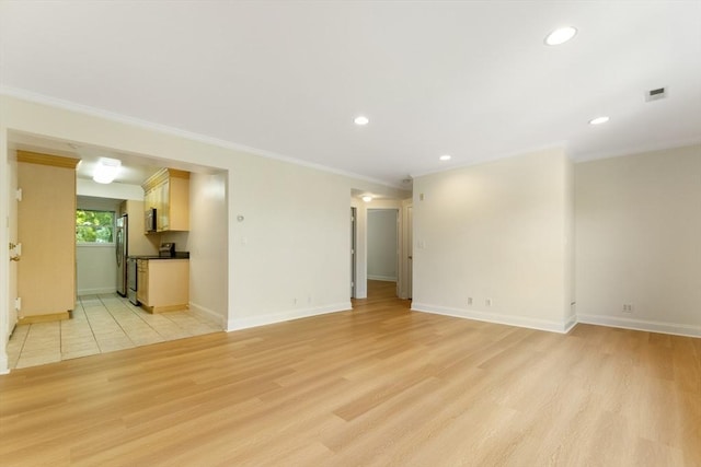 188 Newton Unit 6, Boston, MA 02135 - unfurnished living room featuring light wood finished floors, ornamental molding, baseboards, and recessed lighting