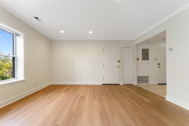 188 Newton Unit 6, Boston, MA 02135 - spare room featuring electric panel, light wood-type flooring, baseboards, ornamental molding, and recessed lighting