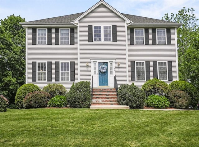 155 Burlington St, Woburn, MA 01801 - colonial-style house featuring entry steps and a front lawn