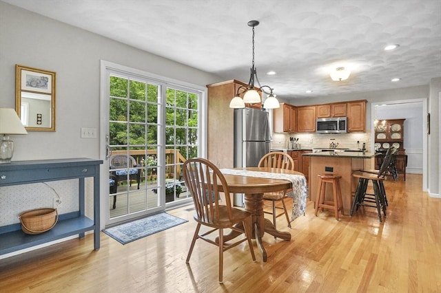 155 Burlington St, Woburn, MA 01801 - dining space with light wood-type flooring and recessed lighting