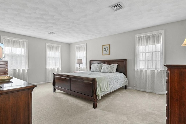 155 Burlington St, Woburn, MA 01801 - carpeted bedroom with baseboards and a textured ceiling
