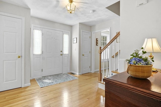 155 Burlington St, Woburn, MA 01801 - entrance foyer featuring stairway, light wood-style floors, and baseboards
