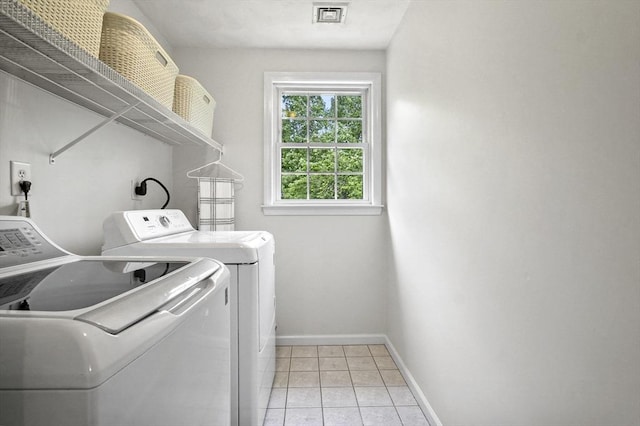 155 Burlington St, Woburn, MA 01801 - laundry room featuring washer and clothes dryer, baseboards, and light tile patterned floors