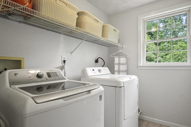 155 Burlington St, Woburn, MA 01801 - washroom with washer and clothes dryer, baseboards, and light tile patterned floors