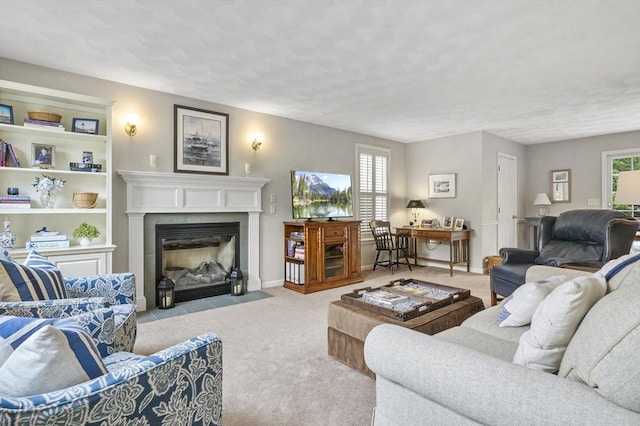 155 Burlington St, Woburn, MA 01801 - carpeted living room featuring a fireplace with flush hearth, a textured ceiling, and baseboards