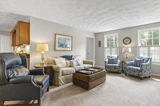 155 Burlington St, Woburn, MA 01801 - living area featuring a textured ceiling, light colored carpet, and baseboards
