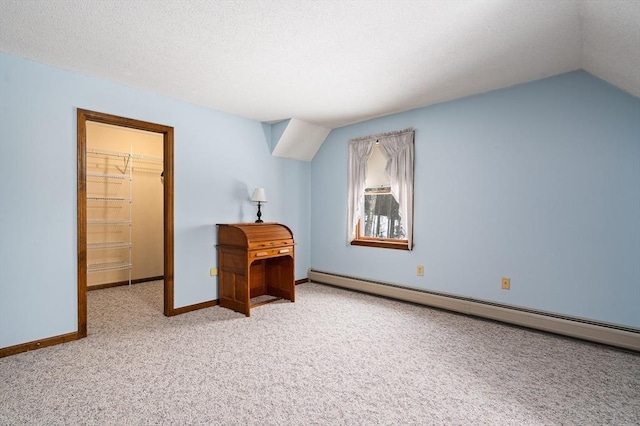 bonus room with carpet floors, a baseboard radiator, lofted ceiling, a textured ceiling, and baseboards