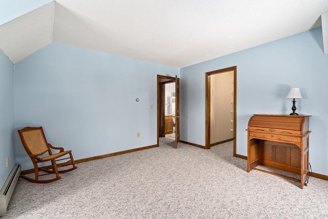 interior space featuring vaulted ceiling, baseboard heating, carpet flooring, and baseboards