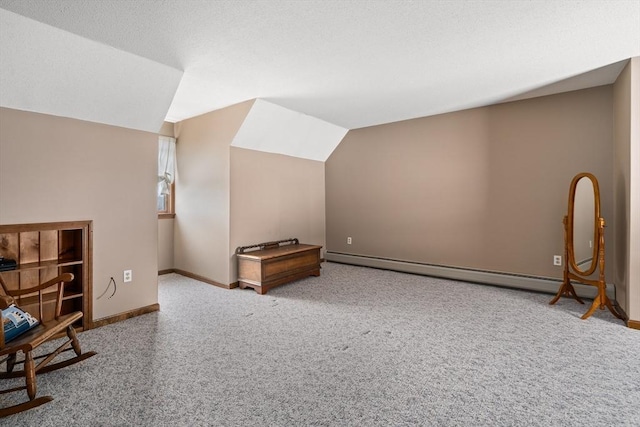 bonus room featuring baseboards, lofted ceiling, carpet, baseboard heating, and a textured ceiling