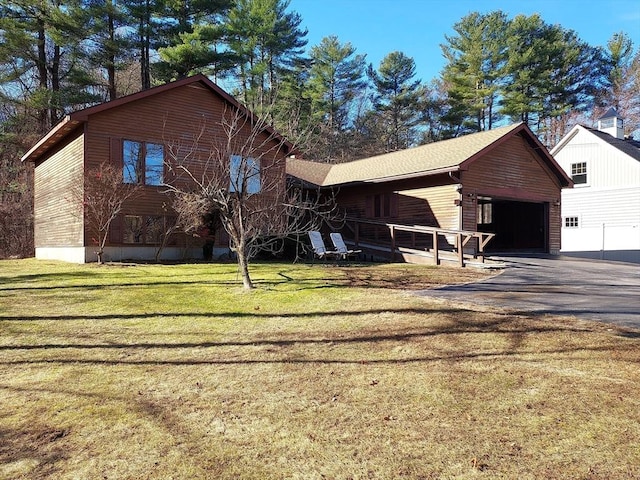 view of front facade with a front yard and a garage