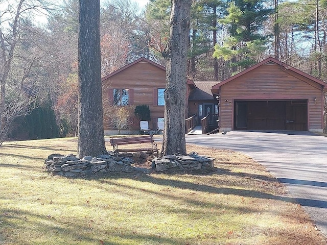 exterior space with a front yard and a garage