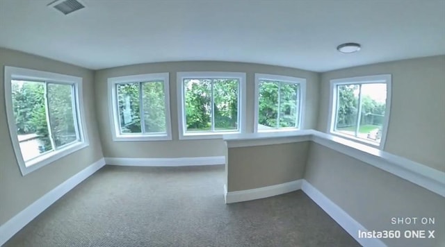 unfurnished sunroom featuring plenty of natural light