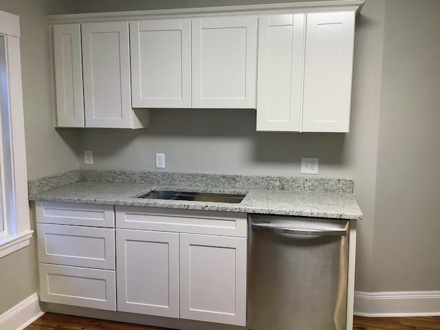 kitchen featuring white cabinets, dishwasher, dark hardwood / wood-style floors, and light stone counters