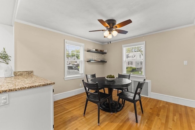 31 Webster St, Randolph, MA 02368 - dining area featuring light wood-style flooring, ceiling fan, baseboards, and crown molding
