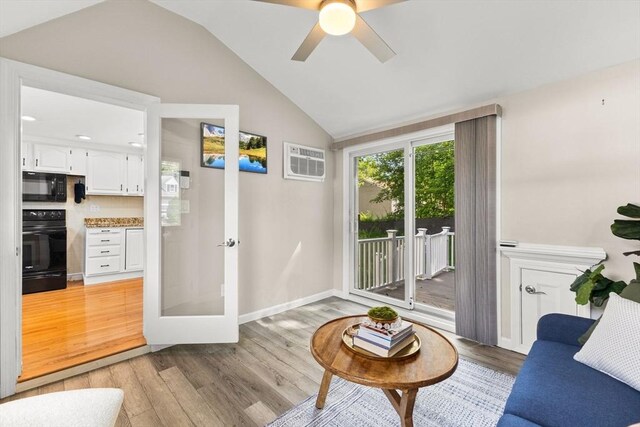 31 Webster St, Randolph, MA 02368 - living area with light wood-style floors, lofted ceiling, a ceiling fan, baseboards, and french doors