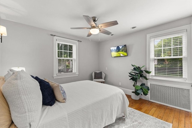31 Webster St, Randolph, MA 02368 - bedroom with radiator, hardwood / wood-style floors, baseboards, and a ceiling fan