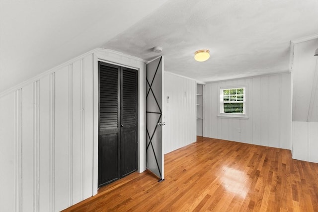 31 Webster St, Randolph, MA 02368 - unfurnished bedroom featuring wood finished floors and a decorative wall