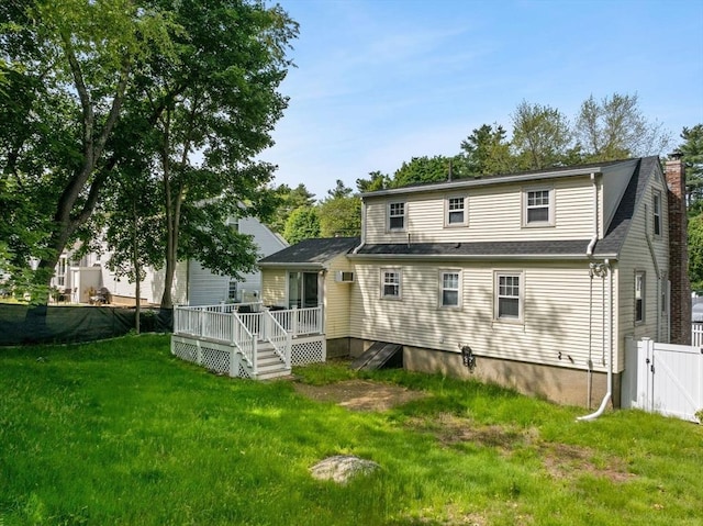 31 Webster St, Randolph, MA 02368 - back of property featuring a deck, a chimney, and a gate