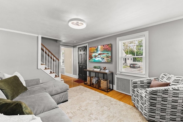 31 Webster St, Randolph, MA 02368 - living area with ornamental molding, stairs, wood finished floors, and baseboards