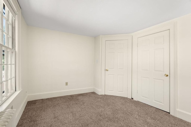 6 River St, Salem, MA 01970 - unfurnished bedroom with carpet floors and radiator