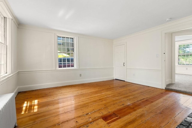6 River St, Salem, MA 01970 - unfurnished room with radiator, hardwood / wood-style flooring, a smoke detector, and ornamental molding