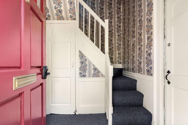 6 River St, Salem, MA 01970 - carpeted foyer with wallpapered walls, stairway, a decorative wall, and a wainscoted wall