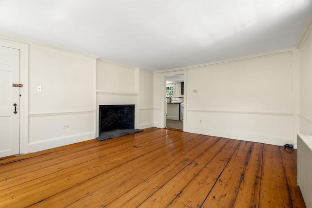 6 River St, Salem, MA 01970 - unfurnished living room with a fireplace with raised hearth and wood-type flooring