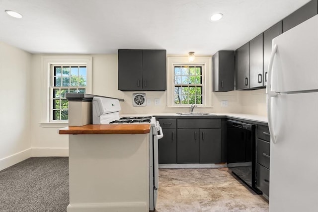 6 River St, Salem, MA 01970 - kitchen featuring white appliances, wood counters, plenty of natural light, dark cabinetry, and recessed lighting