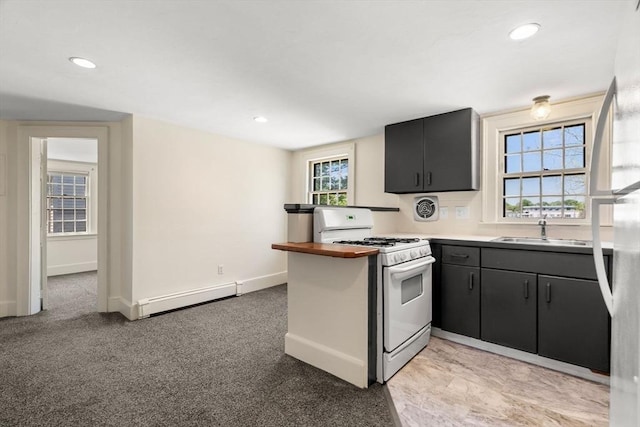 6 River St, Salem, MA 01970 - kitchen featuring white range with gas cooktop, a baseboard heating unit, recessed lighting, light countertops, and a peninsula
