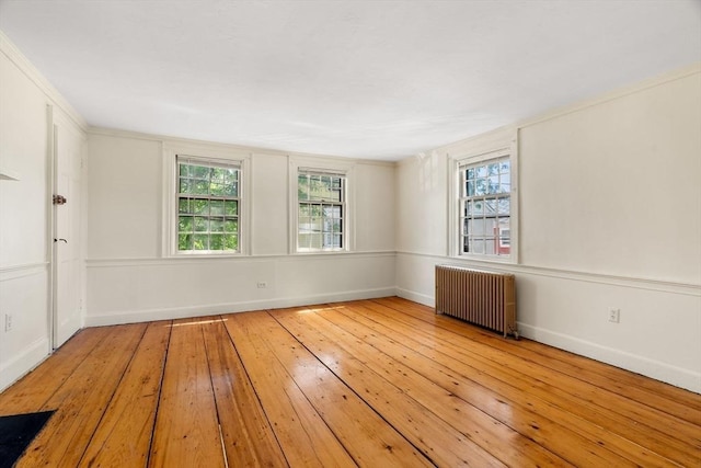 6 River St, Salem, MA 01970 - unfurnished room featuring radiator heating unit and hardwood / wood-style floors