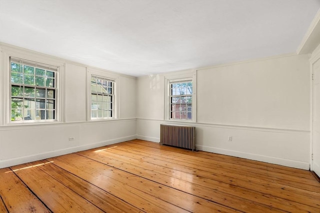6 River St, Salem, MA 01970 - empty room featuring radiator and hardwood / wood-style flooring