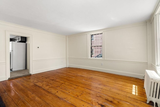 6 River St, Salem, MA 01970 - unfurnished room with radiator heating unit and hardwood / wood-style flooring