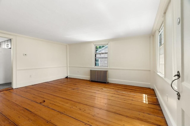6 River St, Salem, MA 01970 - spare room featuring radiator heating unit and wood-type flooring