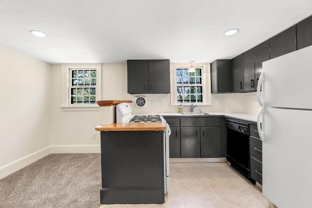 6 River St, Salem, MA 01970 - kitchen featuring freestanding refrigerator, black dishwasher, butcher block counters, dark cabinetry, and recessed lighting