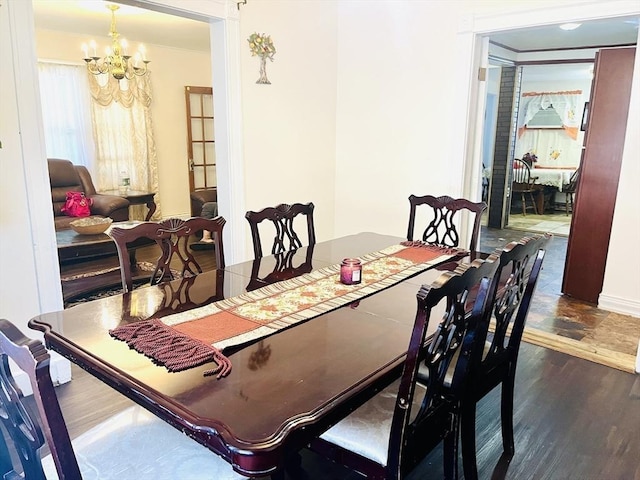 173 Brookway Rd, Boston, MA 02131 - dining room featuring a chandelier, wood finished floors, and baseboards